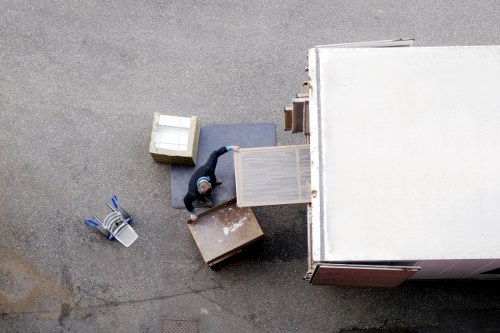 Helper carrying boxes for a home move in Colliers Wood