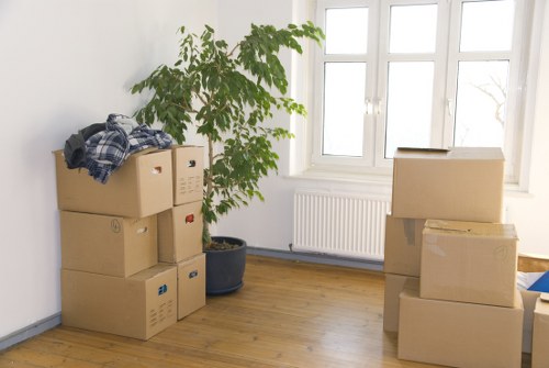 Packed moving boxes and furniture ready for transport