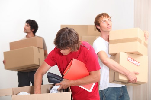 Careful packing materials and boxed household items for moving