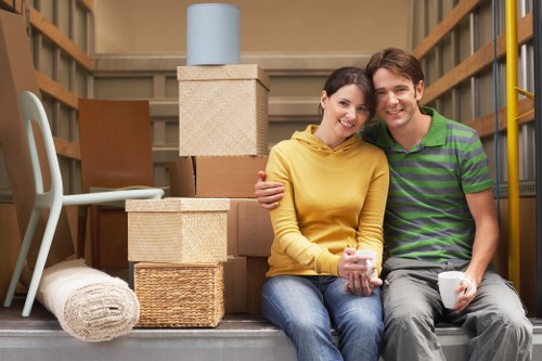 House moving service loading furniture and packed boxes into a van