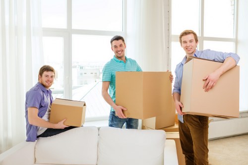 Professional movers handling furniture collection in Colliers Wood