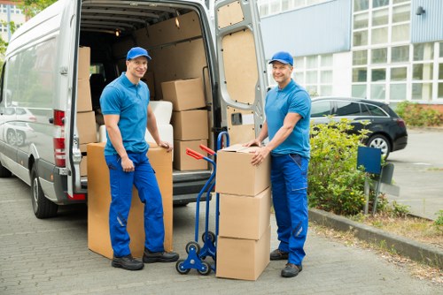 Business premises move preparation with labelled boxes and office chairs